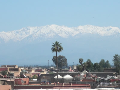 Koutoubia Mosque with the High Atlas mountains in the distance